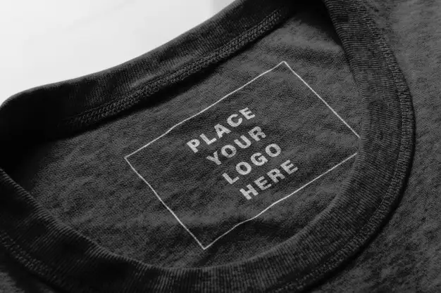 Inside neck label printed with brand logo on a dark t-shirt