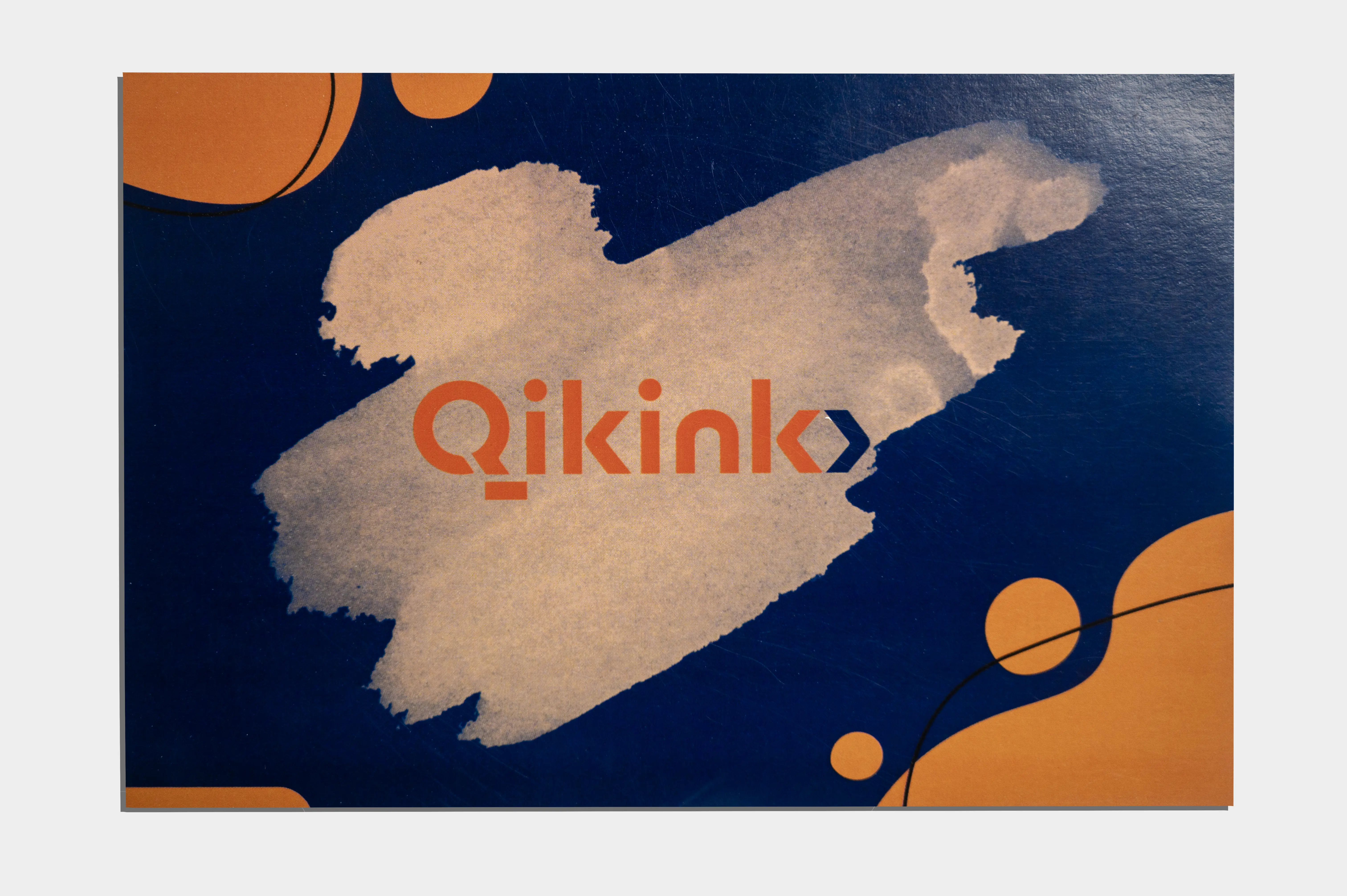 Thank you card sample showing Qikink branded design with orange and blue graphics